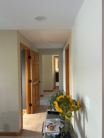 Interior hallway with neutral walls and natural wood trim